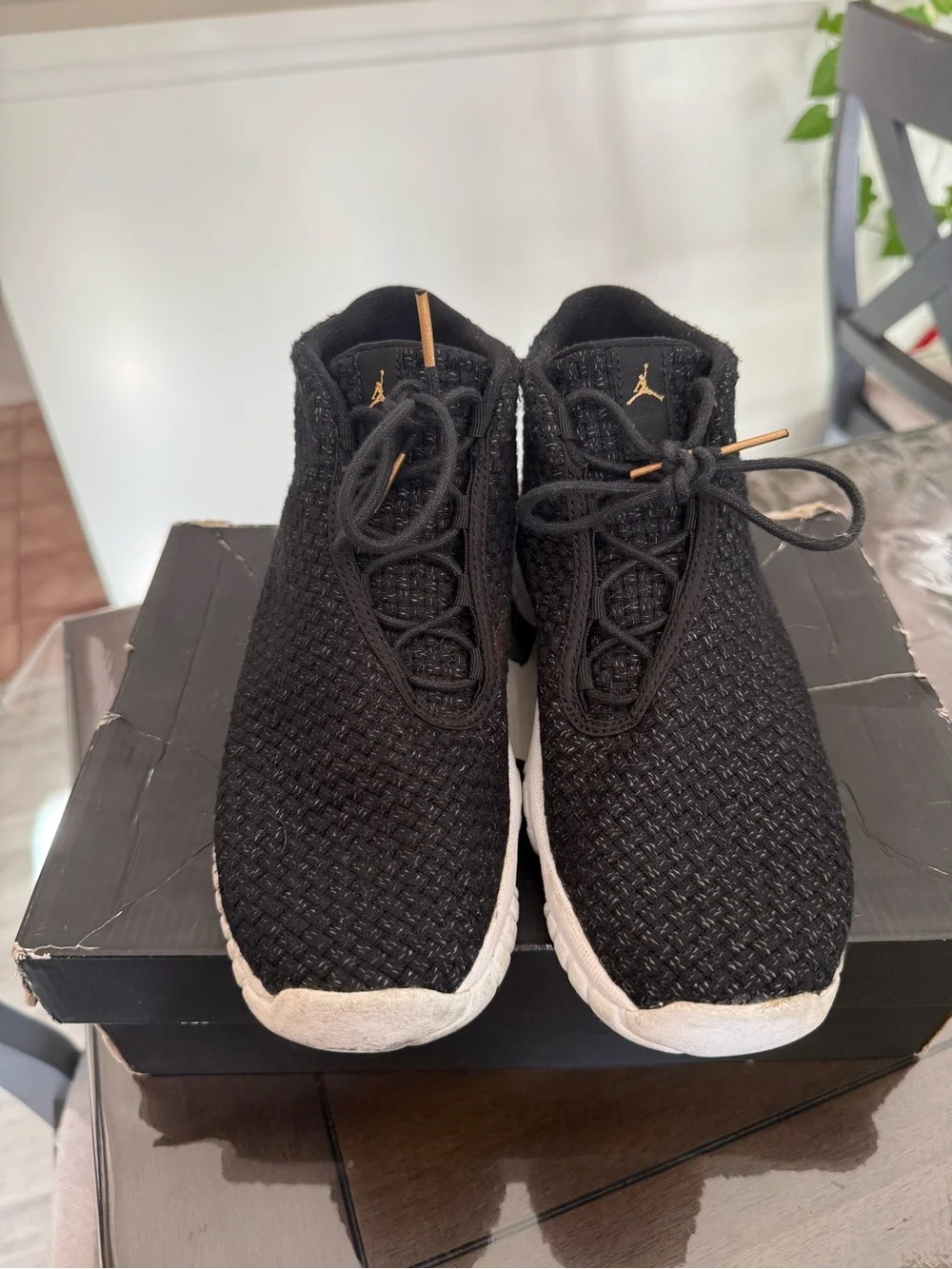 Jordan Men’s Black Knit Athletic Shoes with Gold Accents